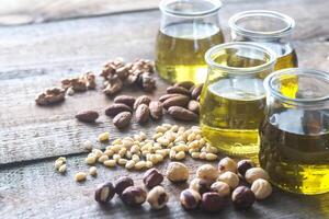 Glass jars with different kinds of nut oil photo