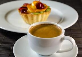 Cup of espresso and dessert photo