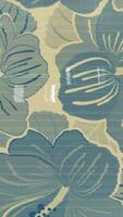 a blue and white floral pattern on a wall video