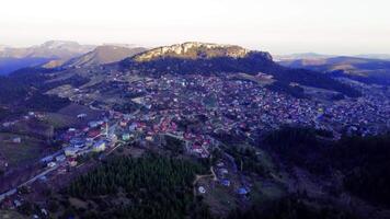 Panoramic drone footage captures a mountain town in Turkey. High-altitude view of mountain town, showcasing landscapes. Drone of mountain town, revealing scenic views. video