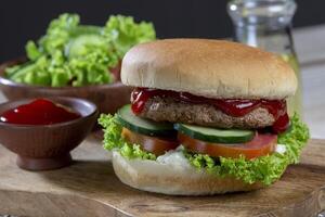 Delicious fresh meat burger with tomato sauce. photo