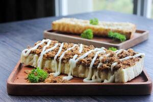 Side view Toast with shredded beef topped with mayonnaise. photo