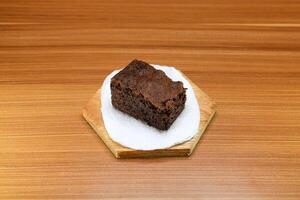 Chocolate brownie cake slices served on a wood. photo