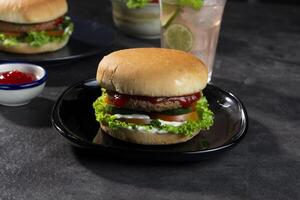 Delicious fresh meat burgers with tomato sauce. photo