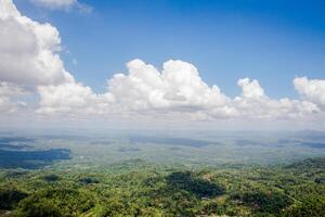 collection of clouds in blue sky in summer with wilderness view. photo