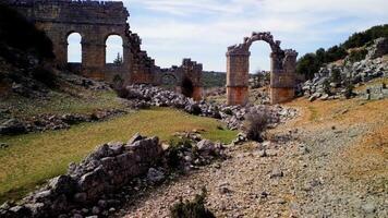 Drone of Olba, Turkey, featuring ancient rome, gate, in ruins. Explore historic ancient rome, gate, from aerial view. Footage highlights ancient rome, gate, among ruins video