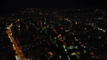 Night over Mersin reveals traffic streams, with traffic lights weaving through city, and traffic patterns illuminating paths in urban tapestry video