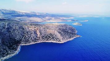 Aerial captures mountain, seascape blend in Turkey bay. Harmony of mountain, seascape in scenic view. Landscape shows unique mountain, seascape interaction video