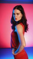 photo of beautiful european woman standing pose with colorful red and blue abstract light ,