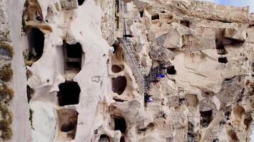 Drone reveals Uchisar Castle's geological splendor in Cappadocia. Stunning geological formations frame Uchisar, highlighting geological wonders of Cappadocia video