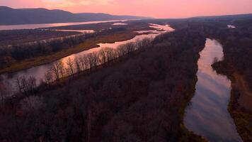 Autumn Overlook Aerial Views of Volga River, Forest, and the Grushinsky Festival Meadow in Warm Glow. Nature of Russia view from a drone in autumn video