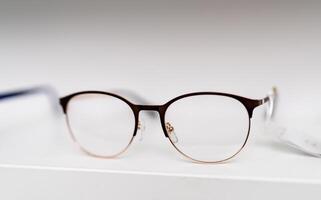 Corrective eyeglasses close up view. Optical plastic eyewear classic glasses. photo