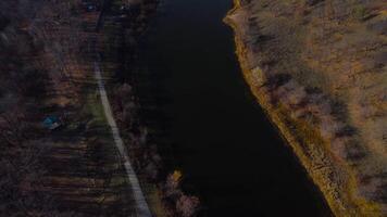 Autumn Overlook Aerial Views of Volga River, Forest, and the Grushinsky Festival Meadow in Warm Glow. Nature of Russia view from a drone in autumn video