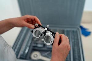 Optometry glasses examining. Professional oculist instruments. photo