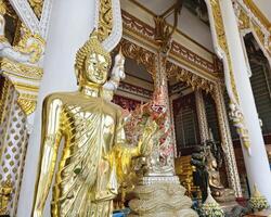 Golden Buddha statue at Rat Prakong Tham Temple, Nonthaburi Province photo