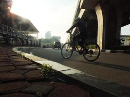 Surakarta, Central Java, Indonesia April 11, 2024. A sight seeing of Main Roads Slamet Riyadi Street in the morning. Not busy yet. People still preparing for their activity photo