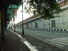 Surakarta, Central Java, Indonesia April 11, 2024. A sight seeing of Main Roads Slamet Riyadi Street in the morning. Not busy yet. People still preparing for their activity photo