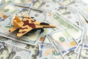 Military toy airplane jet aircraft - on money background photo