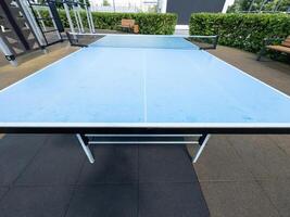 Concrete ping-pong table. Outdoor sports ground. Modern urban public space. photo