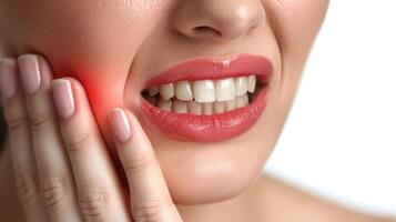 A woman holds her cheek while suffering from a toothache, depicting the discomfort and pain experienced during dental issues, emphasizing the need for oral health care and treatment photo