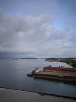 barge with coarse aggregate stone cargo in the waters of Balang Island, East Kalimantan, Indonesia, May 19, 2024 photo