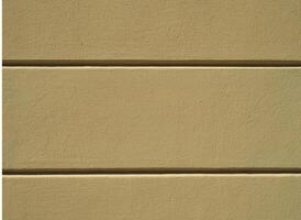 yellow plaster ashlar wall background photo