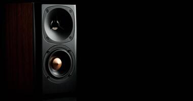 Multimedia acoustic sound speaker on dark background photo