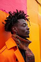 Stylish Man With Dreadlocks Against Colorful Wall photo