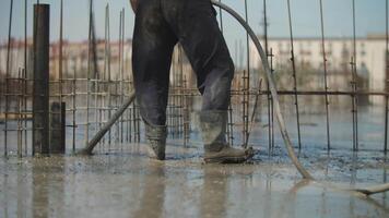 Vibration work with liquid concrete at the construction site video
