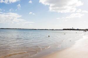 Perfect sandy beach in hot summer day photo