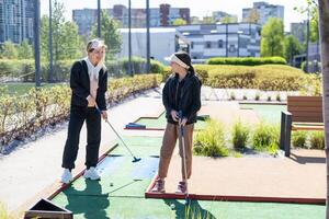 cute little girl on a miniature golf course. photo