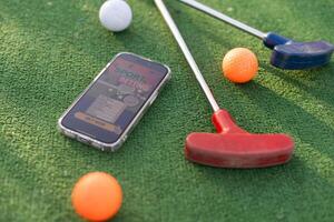 mini golf sports betting on a smartphone photo