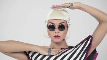 Blonde with dark round glasses and pink lips video