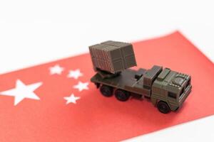 military equipment as tank with flag of China on white background. Countries' military forces topic. photo