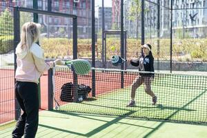 One women playing Paddle tennis photo