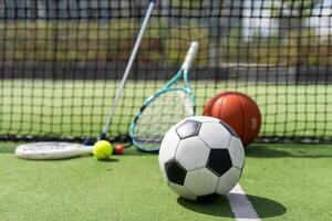 Sport games background - basketball, soccer ball, rackets, sneakers - copy space photo