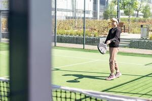 Young girls playing padel on a sunny day photo