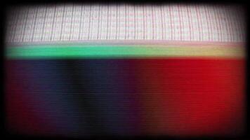 a television screen with a red, green and blue color video