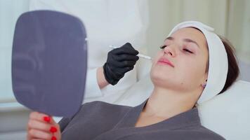 Facial plastic surgeon marking face areas video