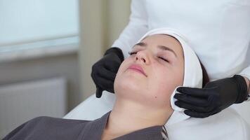 Woman receiving skin cleaning at beauty parlor video