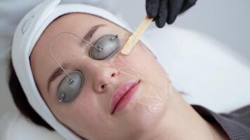 Facial skin cleaning with gel mask at beauty parlour video