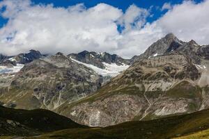 Panorama of cloud layer from mountain top over Swiss alps photo