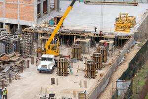 Aerial view of construction site, construction of new building in residential area. photo