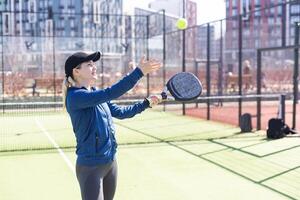 Paddle tennis woman image in court photo