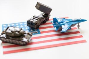 USA flag image photo with a combat plane, khaki green tank and military car standing on american flag