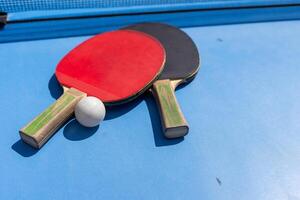 table tennis ball and paddle photo