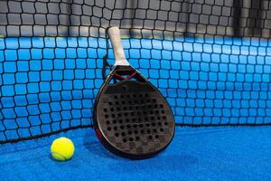 Paddle tennis objects and court. photo