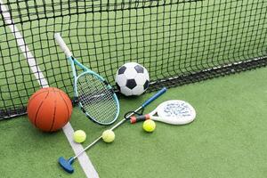 Sport games background - basketball, soccer ball, rackets, sneakers - copy space photo