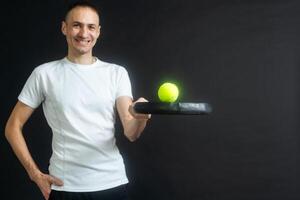 Young man playing the paddle photo