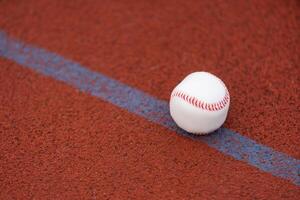 one baseball on infield of sport field photo